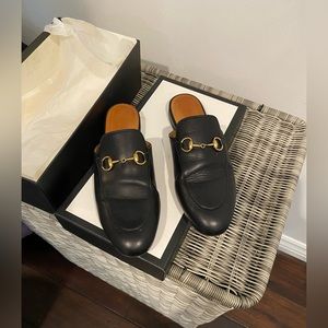 Black Gucci slip-ons